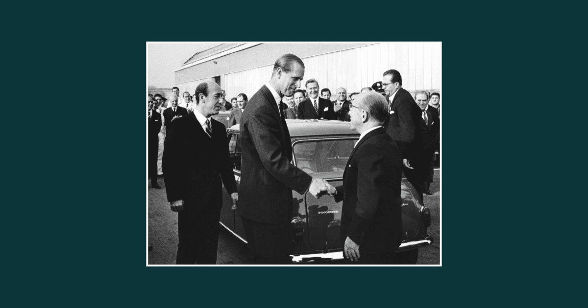 Black and white photo showing Ferdinando and Luigi Innocenti meeting HRH Prince Phillip